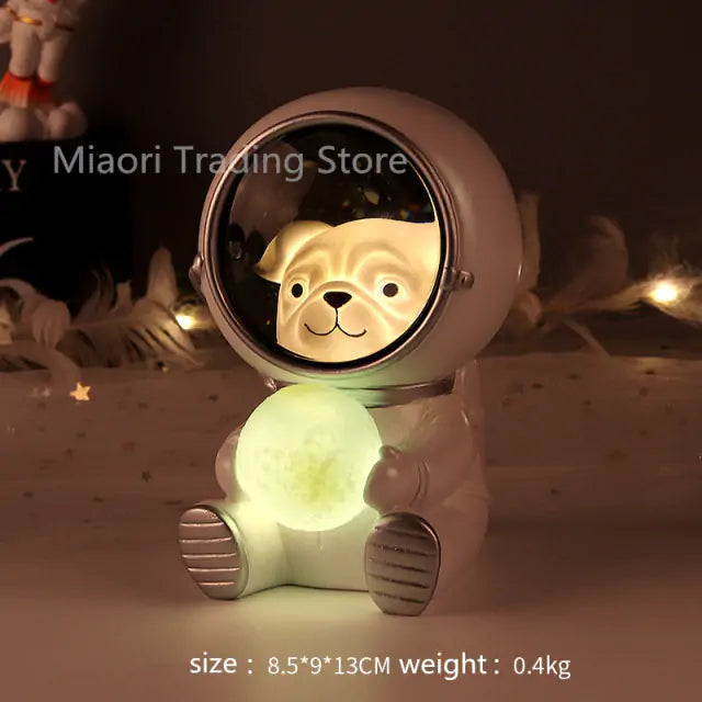 Cute dog-shaped night light with a reflective face on a dark background
