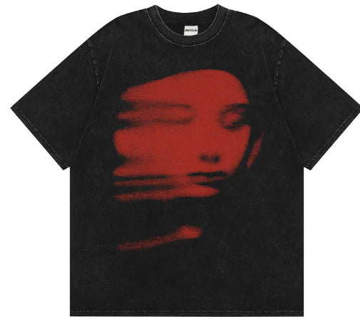 Black t-shirt with a red graphic of a face on a white background