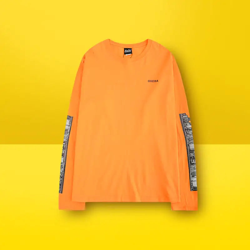 Orange long-sleeve shirt with black text and graphic on a yellow background