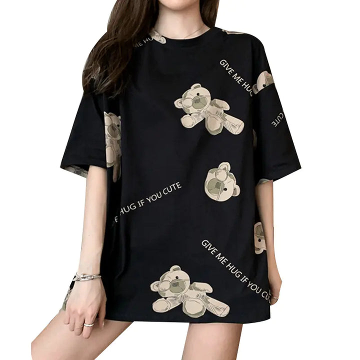 Black dress with teddy bear designs and text worn by a model on a white background