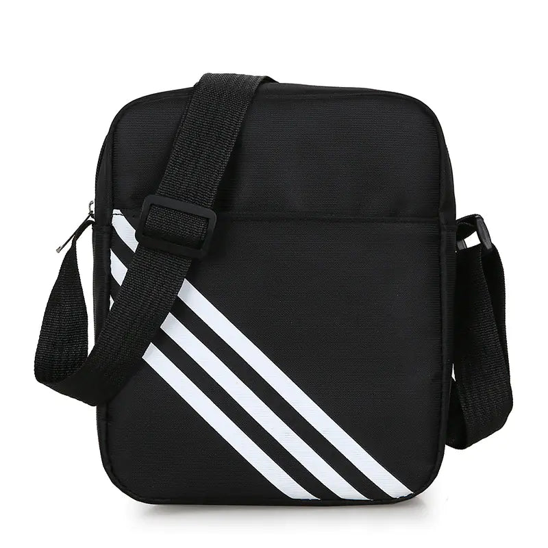 Black crossbody bag with white stripes on a white background