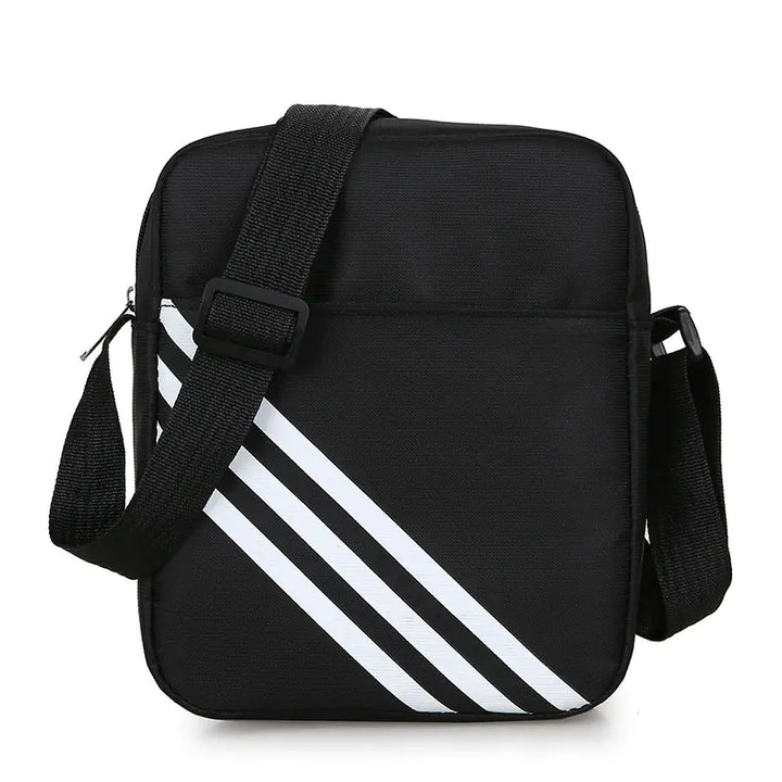 Black crossbody bag with white stripes on a white background