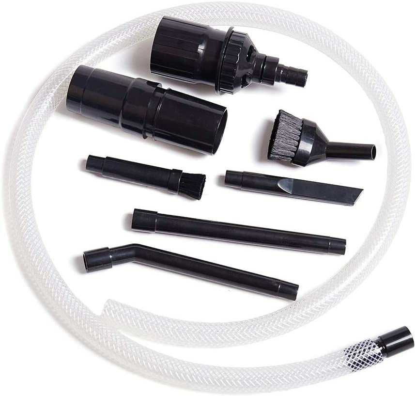 Set of black vacuum attachments with a white hose on a white background