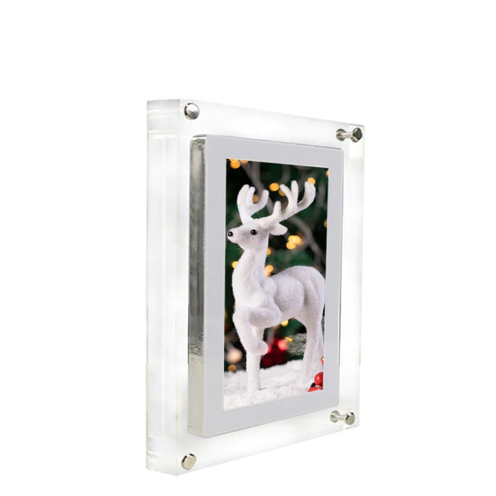 Clear acrylic photo frame with a white reindeer figure inside, on a white background