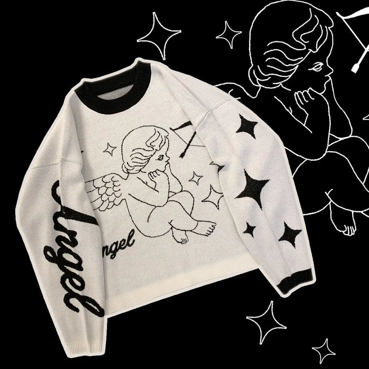 White sweater with angel design and text on a black background