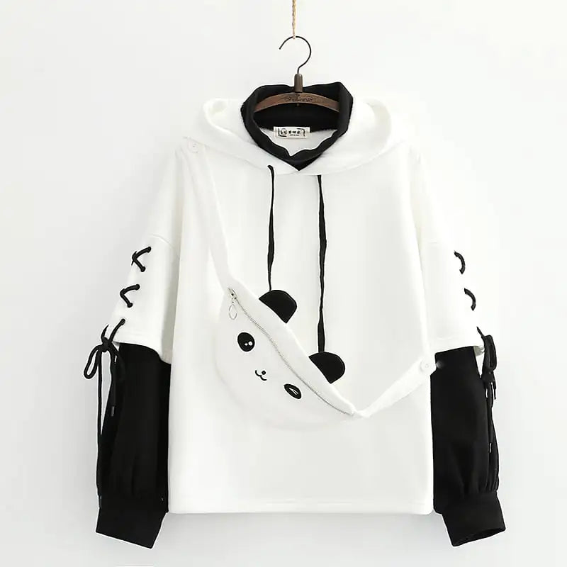White hoodie with black accents on a hanger against a white background